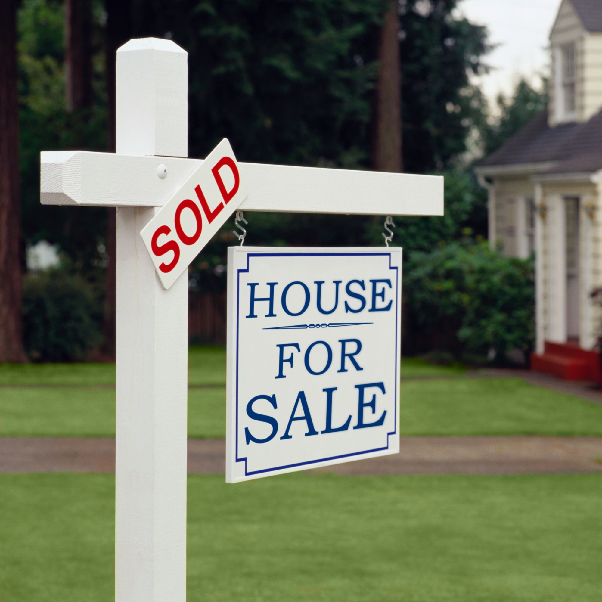 House for Sale and Sold Sign Stock Image